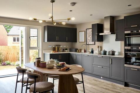 An open plan kitchen and dining area, with double doors to the garden is perfect for al fresco dini