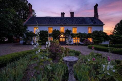 Bury's Hall Ashill manor house facade at sunset wi