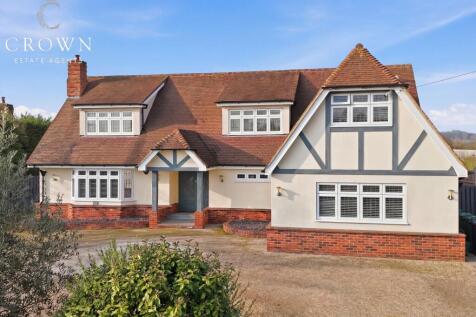 Front Aspect with large gated driveway