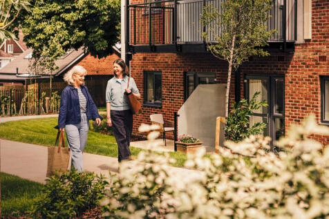 women walking in a garden