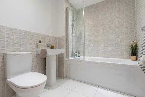 The family bathroom can feature a shower over the bath