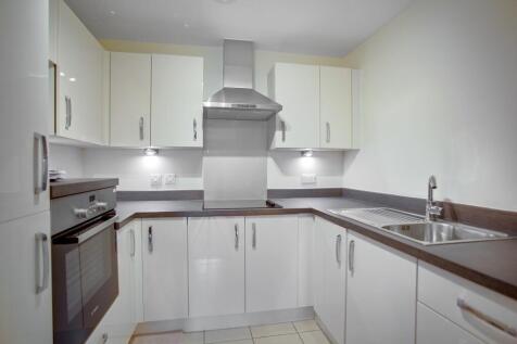 a kitchen with white cabinets
