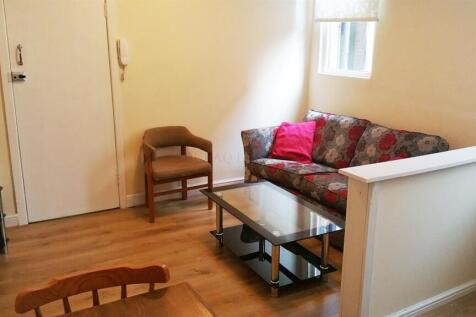 Cosy lounge with sleek wooden flooring...
