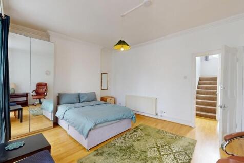 Spacious double bedroom with mirrored storage...