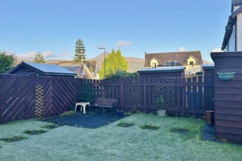 Enclosed rear garden with Goatfell in the backgrou