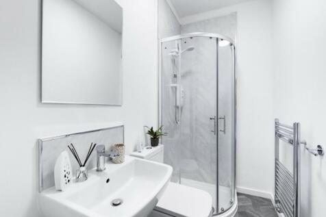 A modern and clean bathroom featuring a stylish...
