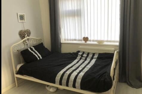 A bright and inviting double bedroom featuring ...