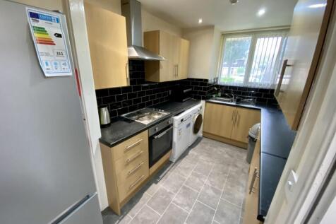 A modern and tidy kitchen with ample storage an...