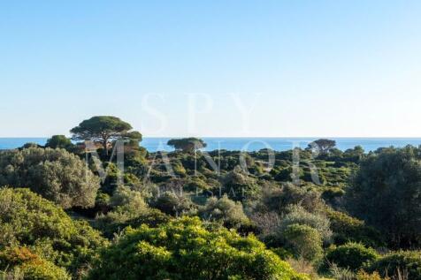 Panoramic frontline Atlantic Ocean view from the Skyblade development plot in Ferragudo, Algarve, surrounded by green coastal nature.