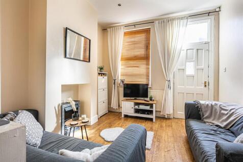 Bright and airy lounge with stylish wood floors...