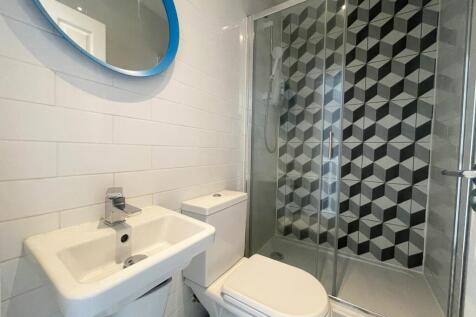 A modern and stylish bathroom featuring a sleek...