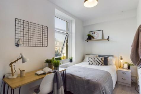 A bright and inviting double bedroom featuring ...