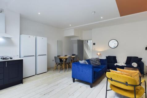 A spacious and stylish modern living room perfe...