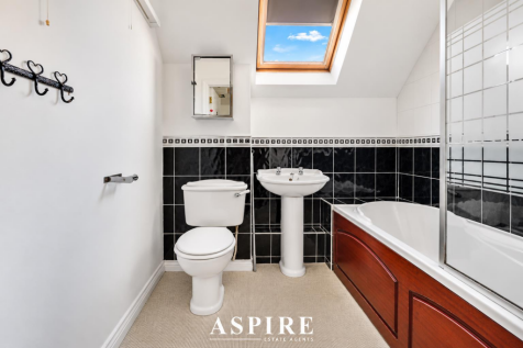 Modern Attic Bathroom with Skylight.png