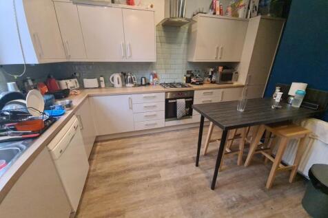 A well-equipped kitchen featuring modern applia...
