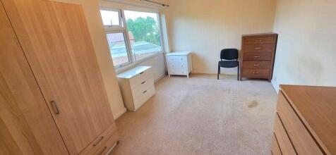 Bright and spacious bedroom with ample storage...