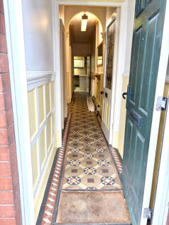 Entrance vestibule and passaged hallway
