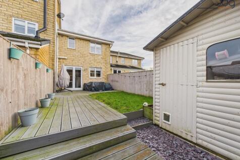 West facing garden with a mixture of lawn and decking