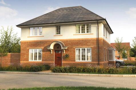 A modern brick and stucco house with a manicured lawn in the foreground sits against a backdrop of t