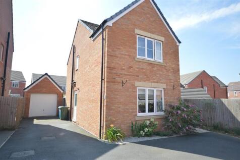 front, driveway and garage