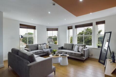 A spacious and stylish modern living room fille...