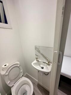 Bright and modern cloakroom with stylish basin...