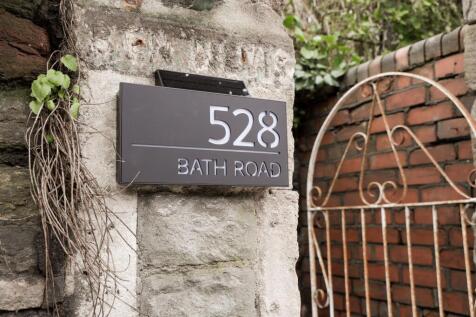 Stylish numbered entrance with decorative gate...