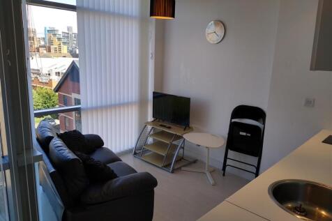Bright lounge area with large floor-to-ceiling ...