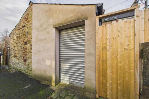Garage accessible from the ginnel