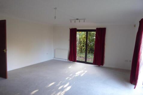 Expansive bright living area with garden access...
