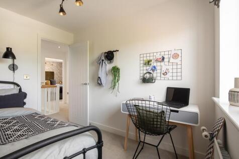 A comfortable extra bedroom offering room for rest, study or imagination