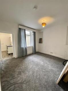 Spacious lounge with fresh grey plush carpets...