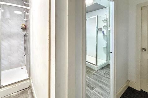 Bright modern shower rooms with sleek tiling....