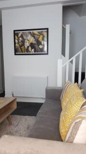 Stylish lounge with plush sofa and modern art...