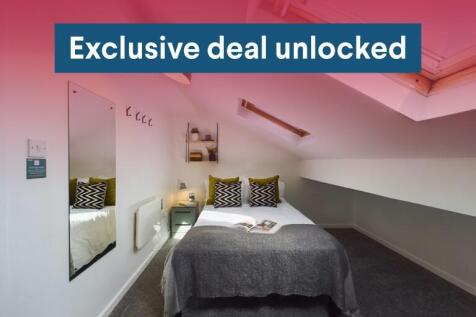 Neat bedroom with a comfortable double bed, con...