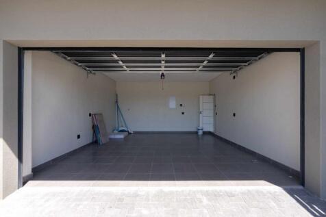 Double garage with enough parking space for two cars in front