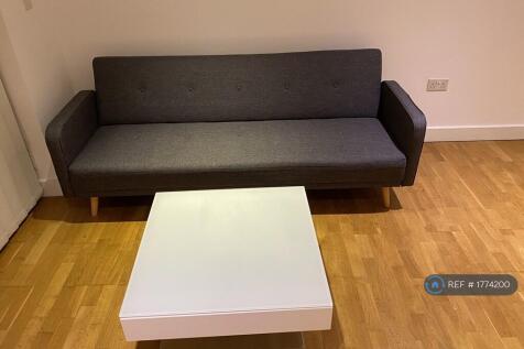 Sofa-Cum-Bed And Coffee Table