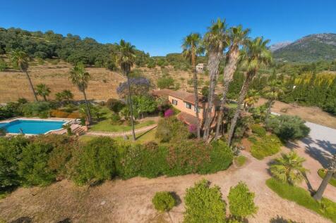 Aerial view of property with pool and garden