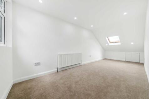 Bright, spacious attic room with plush carpets ...