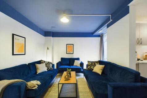 A stylish and spacious modern living room, perf...