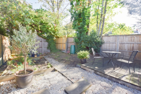 garden with olive tree and table