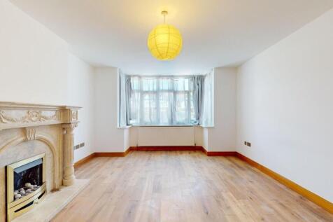Bright lounge with a feature fireplace....