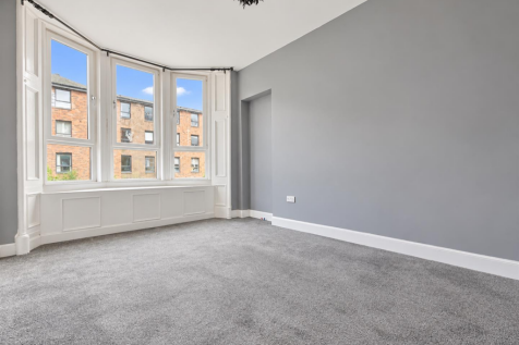 Bright Empty Room with Bay Windows.png