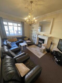 Spacious living room with comfy leather sofas...
