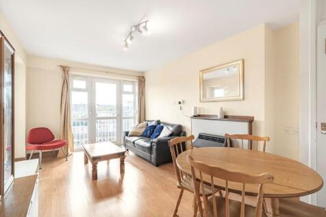 Bright open-plan living room with natural light...