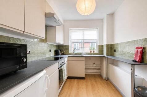 Bright and tidy kitchen with ample counter spac...