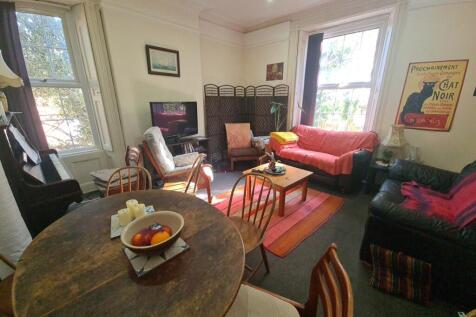 A cozy and inviting living room featuring comfo...