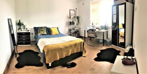 Bright and inviting double bedroom featuring a ...