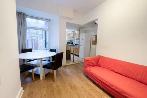 Bright lounge with dining table and sofa...