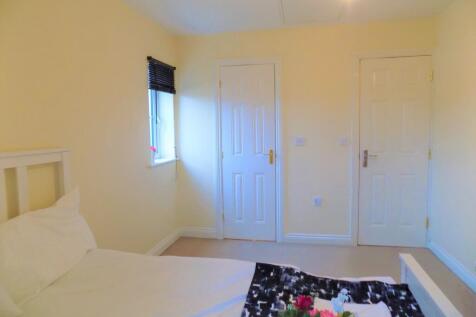 Bright and clean double bedroom featuring soft ...